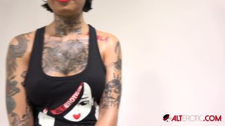 Interview with busty tattooed babe Genevieve Sinn