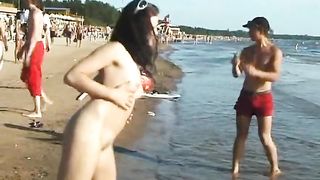 Slim teen with perky boobs naked at a nudist