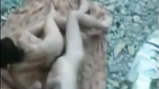 Delicious voyeur sex on a rocky beach captured by a guy who hid himself well