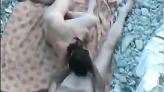 Delicious voyeur sex on a rocky beach captured by a guy who hid himself well