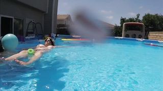 Busty Babe lounges on the pool and show us her giant boobs