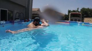 Busty Babe lounges on the pool and show us her giant boobs