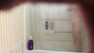 Hardly 18 dame is having a douche not knowing that her step-step-brother is seeing her