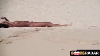 Super-Hot lesbos are bare and liking on the beach, while people are gazing at them