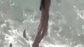 Bare gals and boys are fumbling each other on the beach, while some are even humping