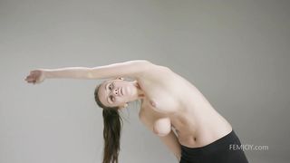 Sporty girl is doing her daily workout routine and taking off her clothes