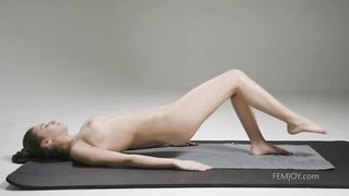 Sporty girl is doing her daily workout routine and taking off her clothes