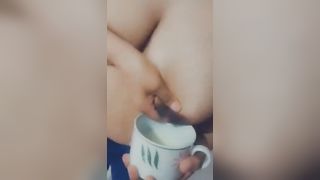 Dark-haired Latina milks her beautiful tits into a glass for her boyfriend