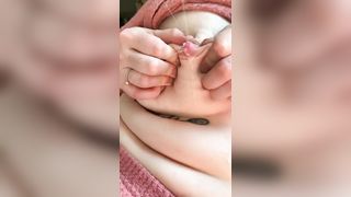 Lots of milk spurting out of her boobs in close-up