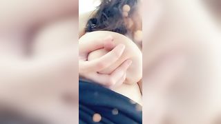 She squeezes jets of her milk out of her nipple