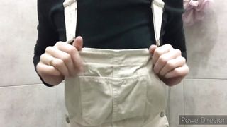 Young beautiful girl milking her boobs in the bathtub. Then she drinks a shot of her milk