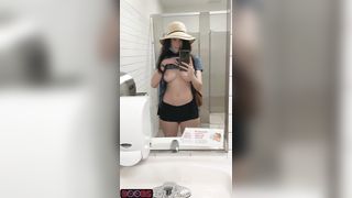 Topless in a public restroom. Forbidden tiktok content