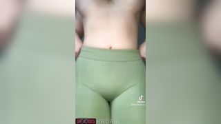 Silicone hottie changes her pants being topless all the time.