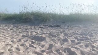 Housewife dangling out a naked beach