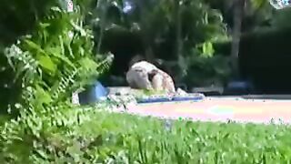 Meaty jug girl-friend providing a hj outside by the pool