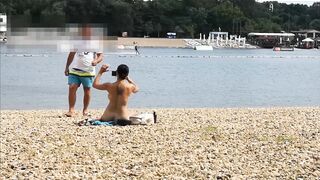 Naked on public beach got lube rubdown from stranger