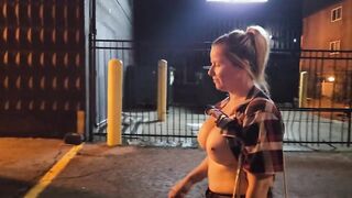 Dame ambles down street bare-breasted